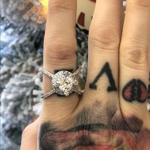 Spectacular four prong bezel set cubic zirconium